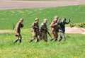 Squad of riflemen escorts POW