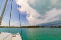 Squall Line Approaches Sailboat Anchored near Island Royalty Free Stock Photo