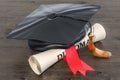 Square academic cap, graduation cap and diploma scroll, 3D rendering Royalty Free Stock Photo