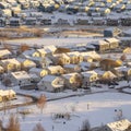 Square Aerial view of homes in snowy Utah Valley neighborhood at sunset in winter Royalty Free Stock Photo