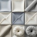 Square arrangement of folded napkins in a grid pattern. The napkins feature neut Royalty Free Stock Photo