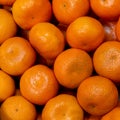 square background with juicy bright tangerines