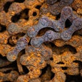 Square background with rusty industrial roller chain, soft focus