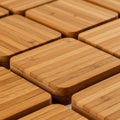 Square bamboo coasters arranged in a grid pattern. Each coaster displays the Royalty Free Stock Photo