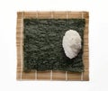 Square base of seaweed for sushi with a rice ball on a mat see