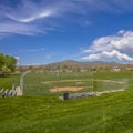 Square Baseball or Softball field with bleachers outside the safety fence Royalty Free Stock Photo