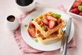 Square belgian waffles with strawberries