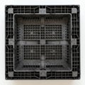 Square black plastic pallet or crate with grid-like structure viewed from above. Made of Royalty Free Stock Photo