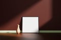 Square black poster or photo frame mockup with vase on the wooden floor leaning against the room wall with shadow Royalty Free Stock Photo