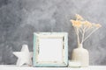 Square blue Photo frame mock up with dry beige plants in vase, ceramic decor on shelf. Scandinavian style Royalty Free Stock Photo