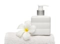 Square bottle soap and flower on white towel white background