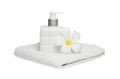 Square bottle soap and flower on white towel white background Royalty Free Stock Photo