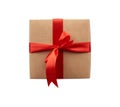 Square box wrapped in brown kraft paper and tied with a red ribbon Royalty Free Stock Photo