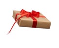 Square box wrapped in brown kraft paper and tied with a silk red ribbon Royalty Free Stock Photo