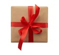 Square box wrapped in brown kraft paper and tied with a silk red ribbon, top view Royalty Free Stock Photo