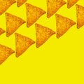 Square bright background of whole triangular nachos slices on yellow color with empty space