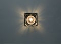 square bright lamp on the ceiling inside the room