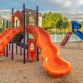 Square Bright orange and blue slides at a colorful fun playground for children