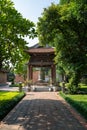 Square building holding a big bell on side of Imperial Academy in Temple of Literature Van Mieu, the first national university Royalty Free Stock Photo