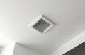 Square ceiling vent. Metal grid air duct. Ventilation system in kitchen. Climate control indoors. White interior. Modern Royalty Free Stock Photo