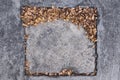 The square cement with dried leaves as frame