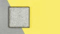 Square ceramic mosaic grey plate on gray and yellow background