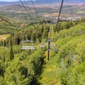 Square Chairlifts and aerial view of mountain hiking trails and buildings in summer