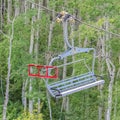 Square Chairlifts over mountain and trees on a sunny summer day in Park City ski resort