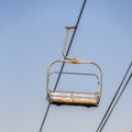 Square Chairlifts in Park City Utah ski resort against cloudy sky during off season