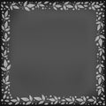 Square chalkboard background with decorative frame of white leaves and dots