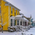 Square Charming homes on a snow covered landscape during winter in Daybreak Utah