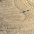 Square Close up of golf course sand bunker with a circular pattern created by the rake