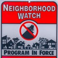 Square Close up of a Neighborhood Watch sign against a blurred background Royalty Free Stock Photo