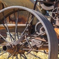 Square Close up of the rusty wheels of an old vintage tractor on a farm on a sunny day Royalty Free Stock Photo