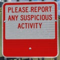 Square Close up of a sign that reads Please Report Any Suspicious Activity