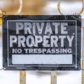 Square Close up view of a weathered sign that reads Private Property No Trespassing Royalty Free Stock Photo