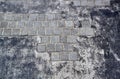 Square cobblestone on pavement on gray acrylic asphalt