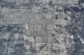 Square cobblestone on pavement on gray acrylic asphalt