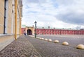 square with cobblestone pavement in the Peter and Paul fortress, St. Petersburg, buildings in the Peter and Paul fortress