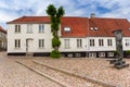 Square with cobblestones and historic houses in Haderslev Royalty Free Stock Photo