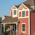 Square Colourful red timber suburban house near sunrise Royalty Free Stock Photo