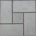 Square concrete tile with geometric patterns