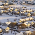 Square crop Aerial view of homes in snowy Utah Valley neighborhood at sunset in winter Royalty Free Stock Photo