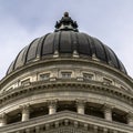 Square crop Dome and pediment of Utah State Capital building in Salt Lake City against sky