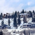 Square crop Park City Utah neighborhood with homes that sit on snowy mountain in winter Royalty Free Stock Photo