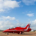 Square crop of the Red Arrows under a blue sky