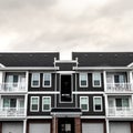 Square crop Small upmarket apartment block with balconies day light Royalty Free Stock Photo