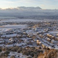 Square crop Sunset in Utah Valley with homes on a snowy neighborhood with mountain view