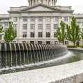 Square crop Water pool fountain against Utah State Capital building dome and pediment Royalty Free Stock Photo