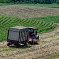 Square - dairy farmer harvesting haylage